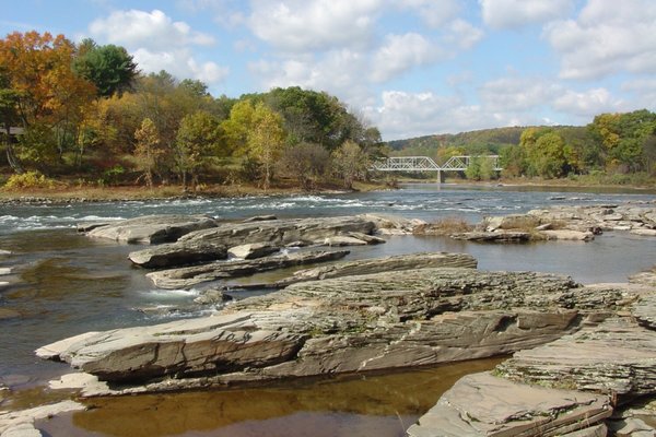 Rocky beach is 7-minute walk downstream from bridge