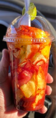 Fruit cup with watermelon, pineapple, cucumber, mango, cantaloupe, chamoy and chili (powder Lucas)