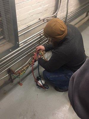 NESC Field Manager performing backflow inspection