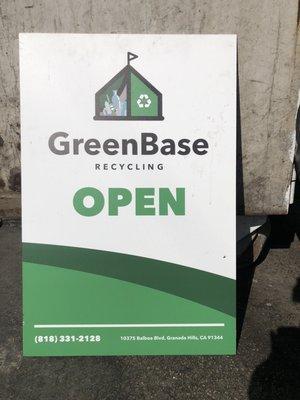 Green Base Recycling open sign posted during hours of operation.