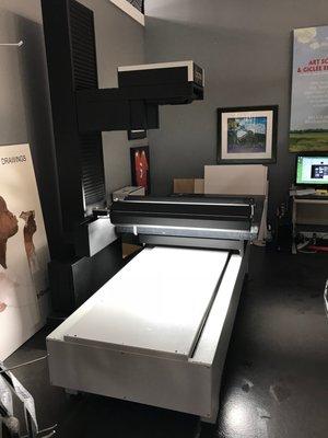 They have an enormous scanner than can handle nearly any artwork, no matter how large or small.