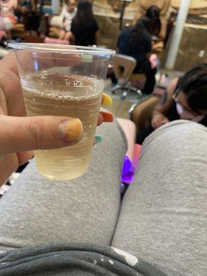 Enjoying my wine with my pedicure