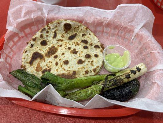 Cheese quesadilla with green chili sauce