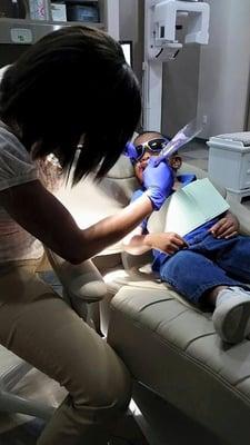 Dr. Erin Issac at work with her little patient