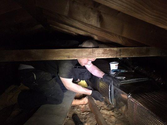 Complete A/C install. Wrapping ductwork in the attic.