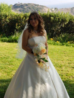 Wedding photo. These really nice ladies did my hair and makeup. They added hair extensions, eye lashes and placed the veil and Tierra.