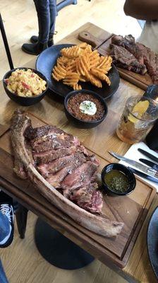 32oz tomahawk steak, loaded Mac and cheese and waffle fries.