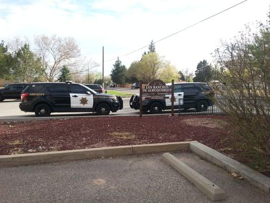 Main sign with Sheriff's squad cars