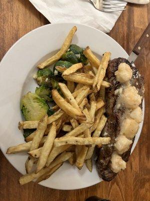 fries, shrimp scampi on steak.