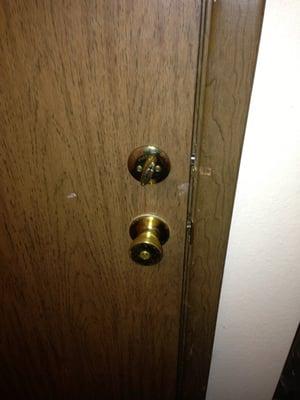 Bottom lock is a cheap bedroom security lock that wouldn't engage.  The only thing holding the door shut is the deadbolt.