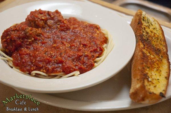 Homemade Spaghetti Sauce over pasta with garlic bread.