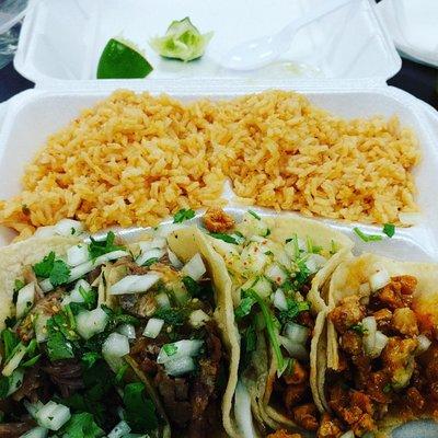 Pork and chicken tacos! $1.50 each plus rice.