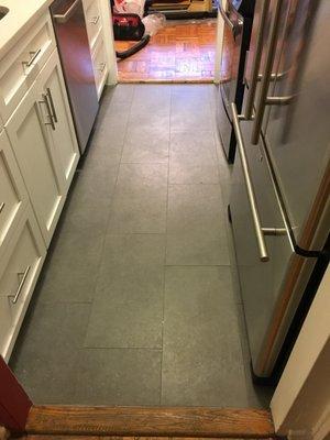 Replaced old tile floor with new tiles - kitchen renovation