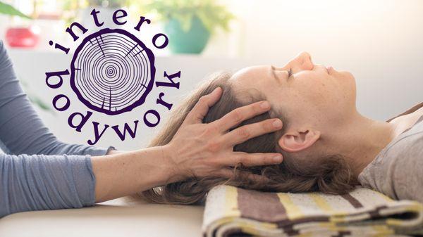 Intero Bodywork logo on top of image of woman receiving somatic therapy.