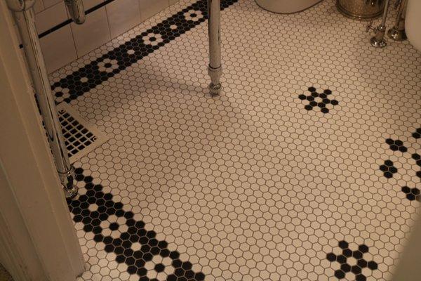 Custom hex floor with a meticulously detailed inlay