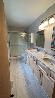 Remodeled bathroom... fresh paint, new cabinets, shower doors, floor and light fixture