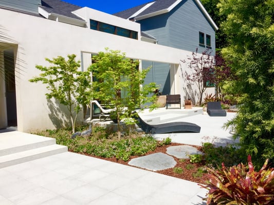 Private garden with maple trees.