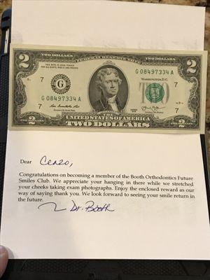 A card and $2.00 bill that Dr. Booth mailed to my 9 year old son, after our evaluation appointment. Very cool & very impressive.