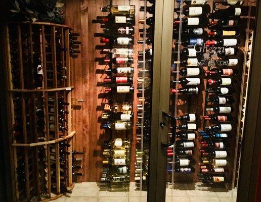 GHEZZI'S WINE CELLAR HOLDS 600 BOTTLES OF WINE & OVER 120 DIFFERENT VARIETIES.