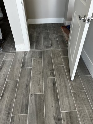 This was a painstaking procedure as the hallway and bathroom had non-paralleled tiles.