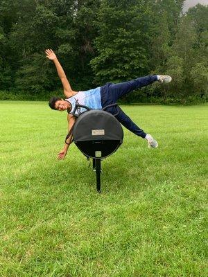 Student learning how to vault on the vaulting barrel before practicing on the horse.