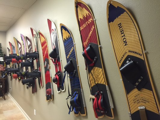 Come by our office to check out our vintage Burton snowboard collection!