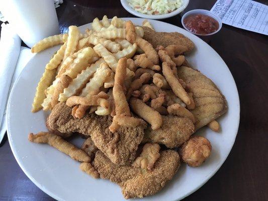 Seafood platter.   Catfish strips, flounder, shrimp, clam strips, fries and slaw.