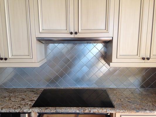 Installed aluminum tiles as a backsplash for Coastal Flooring.  The finished product.  Thanks Tone, we look forward to the ne...