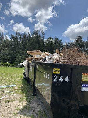 20yd dumpster slightly overloaded. We can handle it