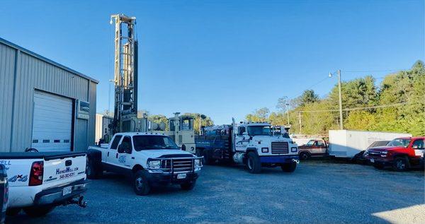 drill rig, water rig tender, and one of our work trucks