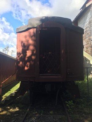 End of the passenger car. Quarters are tight here, and this is in the part blocked of/fences in.