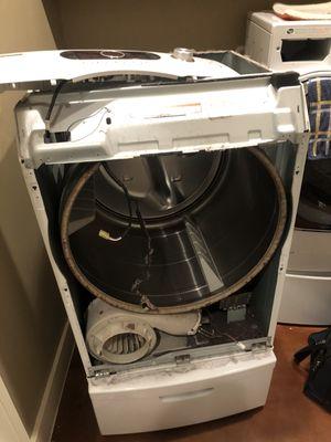 Fixing a dryer that was squealing real loud.