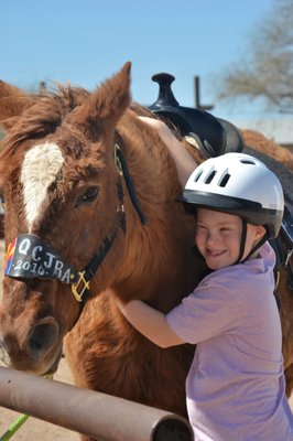 Child with therapy horse