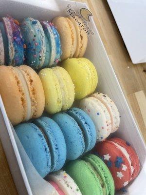 A dozen macarons of different flavors