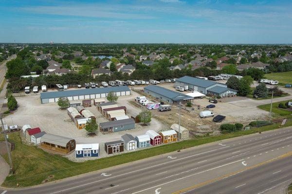 Almost 6 acres with multiple businesses: 2 shoppes, Gunner's gaming parlor, self-storage/outside RV storage, Prairie Built Barns dealership.