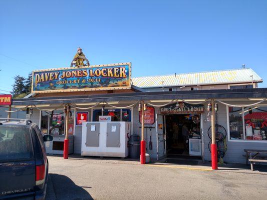 Right after the drawbridge. Great stop when you're heading to Cape Arago. Salt Water Taffy, prepared food and a C Store.