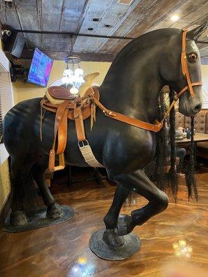 Life size horse statue at front door.