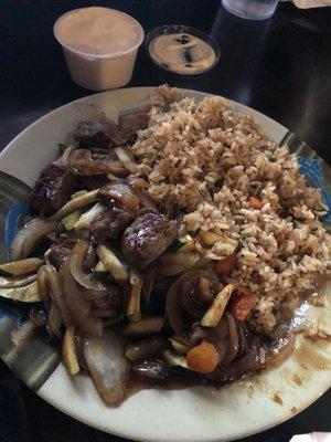 Steak hibachi with onions, zucchini & fried rice