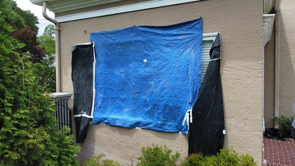 Original wood window destroyed after hail storm