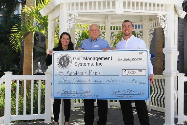 $4000 Donation.  Left - Lacey of Academy Prep, Center- Tim, CEO of Tradewinds, & Right- John of Donor BOO$T