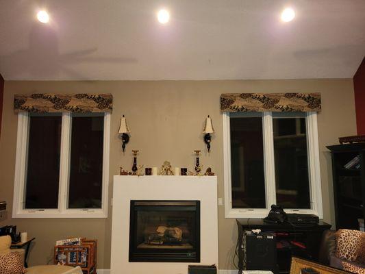 Fireplace wall that was painted in shittake on walls and off white on mantle and painted the windows amd trim after new window installation