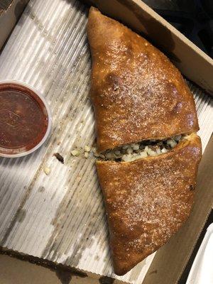 Huge calzones! Packed full of toppings. No sauce on the inside, but they give you a side of marinara.