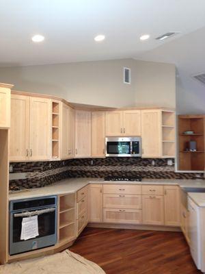 A simply elegant kitchen with bright maple cabinetry.