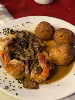 Chicken and shrimp Marsala with rice balls.