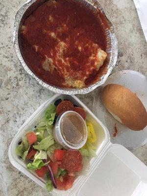 Lasagna with salad and small bread