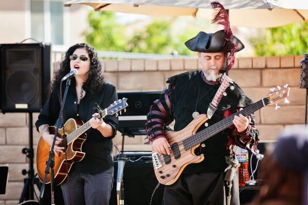 Natalie rocking out at a pirate themed wedding, DJs, performs, she's our girl.