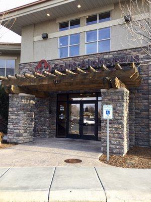 Front entrance door. Enter through but take the stairs to the left or take the elevator on the right to the 2nd of the two story building.