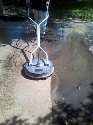 Power Washing of a drive way you can see how dirty it really is. Call me today for power washing needs  936-232-7175