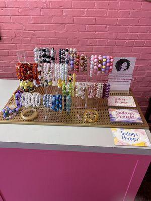 Handmade jewelry and prayer cards for every customer that steps in and shop.