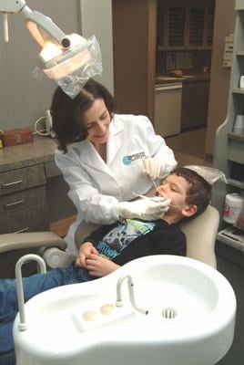 Wilmington Children's Dentist, Dr. Anne Annone Working  with a Patient